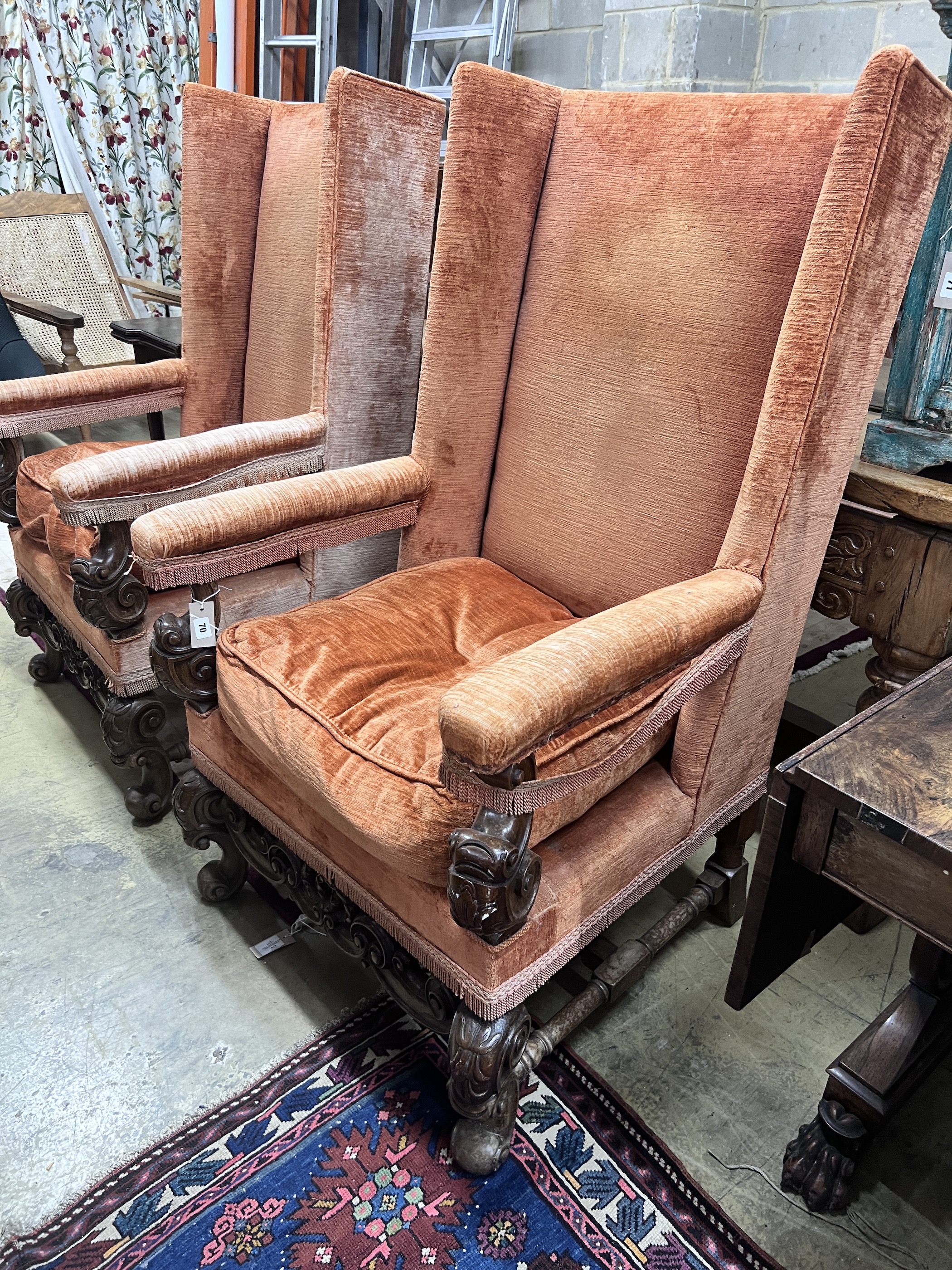 A pair of 18th century style upholstered wing armchairs, width 72cm, depth 76cm, height 130cm